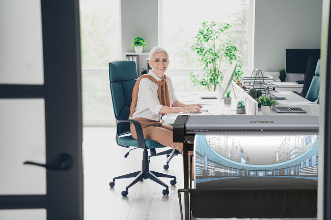 Woman next to Contex SD One scanner